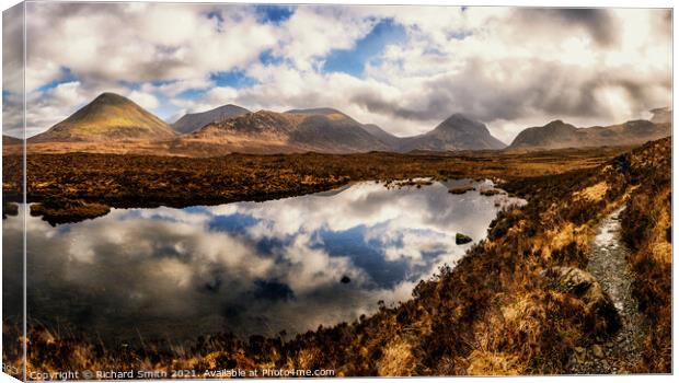 A small Loch beside the footpath to Coire a' Bhàsteir in the Black Cuillins of Skye. Canvas Print by Richard Smith