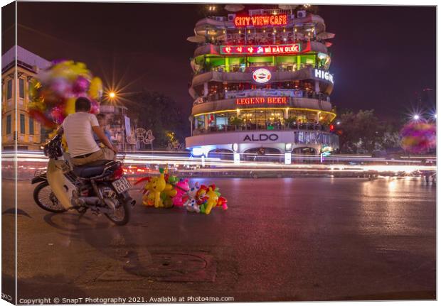 Long exposure of a balloon sellar at Dong Kinh Nghia Thuc Square, Hanoi Canvas Print by SnapT Photography