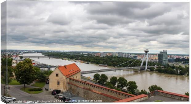 A view across the River Danube, Most SNP Bridge, and Ovsiste, Bratislava Canvas Print by SnapT Photography
