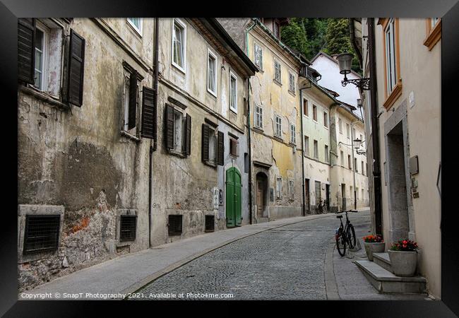 An old, historic, medieval street in Ljubljana, near Ljubljana castle, Slovenia Framed Print by SnapT Photography