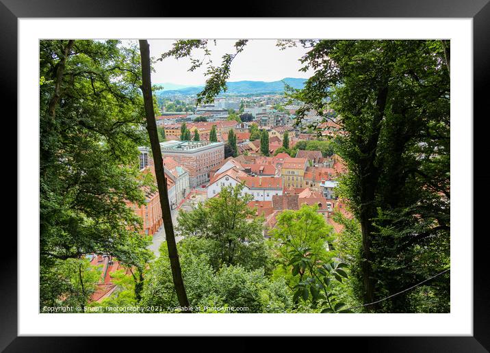 A view through the trees from the view point on Ljubljana Castle, Slovenia Framed Mounted Print by SnapT Photography