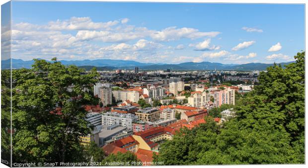 A view over Ljubljana to the mountains from the view point at Ljubljana Castle Canvas Print by SnapT Photography