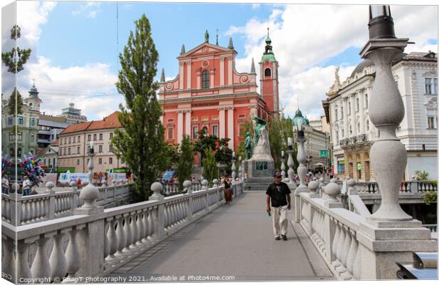 A view of the Franciscan Church across the Tromostovje or Triple Bridges Canvas Print by SnapT Photography