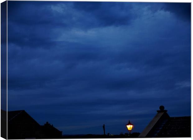 Lamplight blue night sky in Yorkshire Canvas Print by Roy Hinchliffe