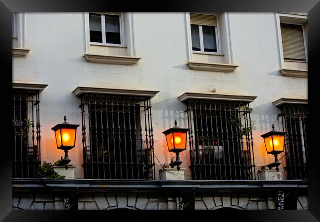 Three lamps by windows in Seville Framed Print by Jose Manuel Espigares Garc