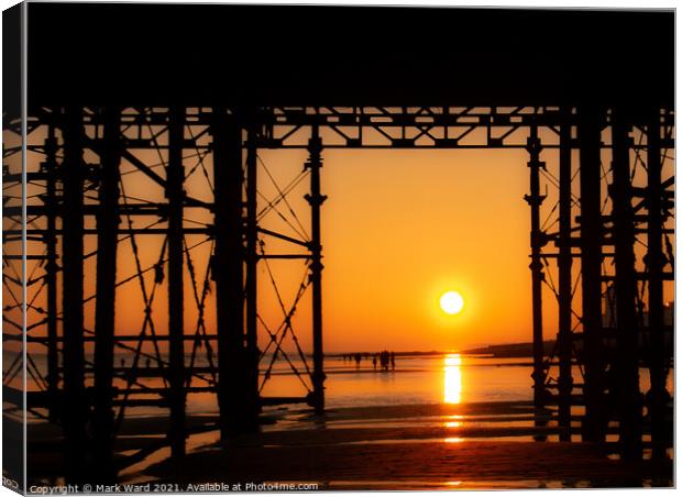 Appearing Through The Pier Canvas Print by Mark Ward