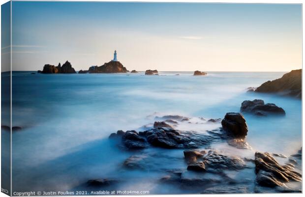 The lighthouse at La Corbiere, Jersey, Channel Isl Canvas Print by Justin Foulkes