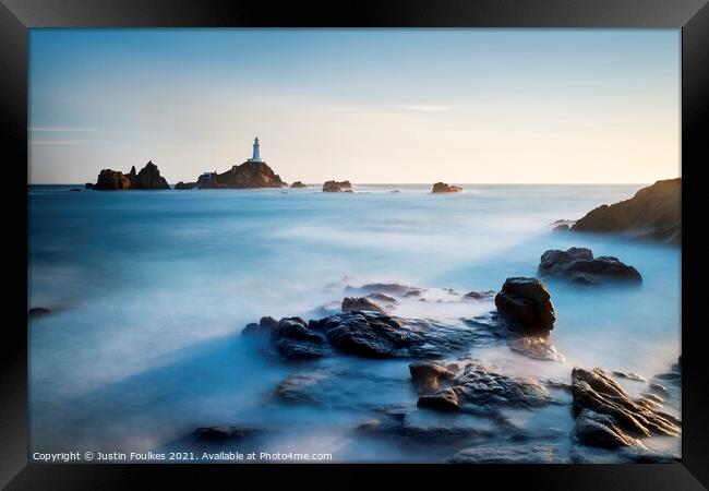 The lighthouse at La Corbiere, Jersey, Channel Isl Framed Print by Justin Foulkes