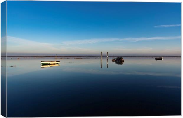 Reflections on a calm day at Brancaster Staithe  Canvas Print by Gary Pearson