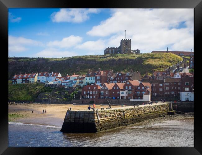 Whitby Abbey overlooking the harbour wall Framed Print by David Hall