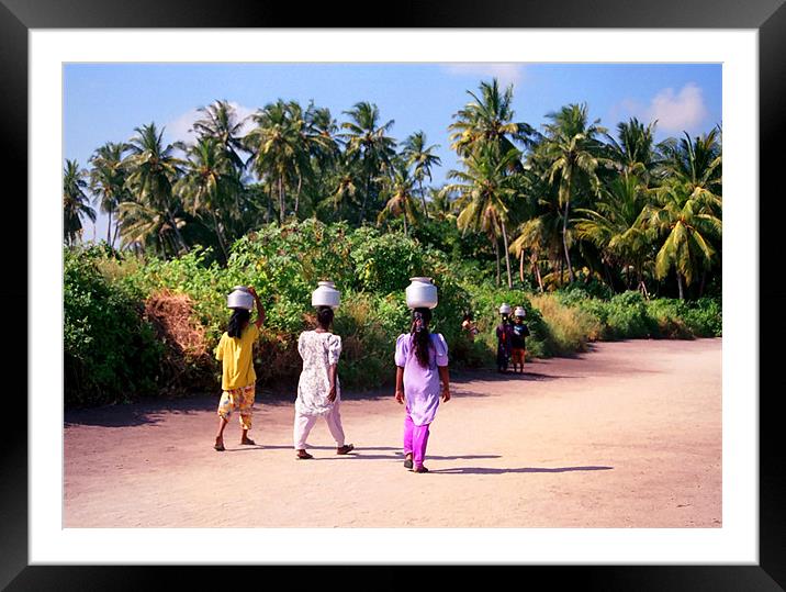 carrying water Framed Mounted Print by Hassan Najmy