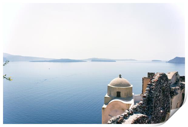 Santorini, Greece - September 11, 2017: Wide angle view of typical Church dome in Firostefani village and sea view with mountains in oia region against mediterranean sea. Print by Arpan Bhatia