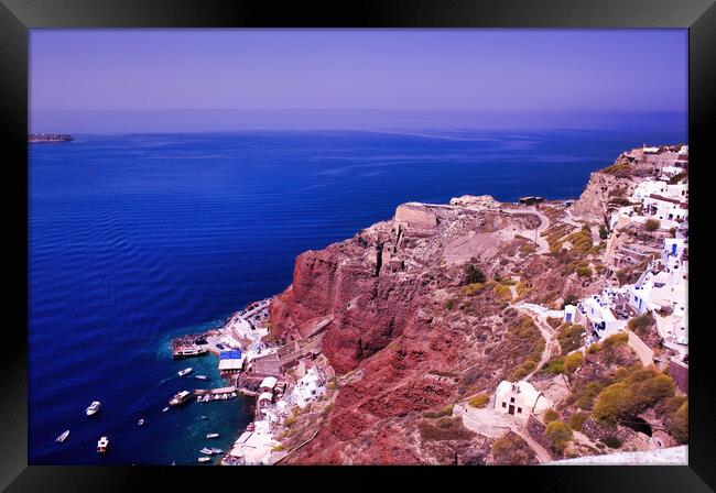 Imerovigli, Santorini, South Aegean, Greece. View to the clifftop village during daytime. Wide angle shot of houses on a volcanic mountain against blue mediterranean sea in Oia Framed Print by Arpan Bhatia