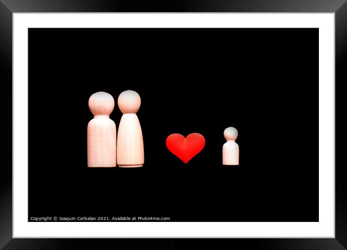 Wooden figures representing the love of the family, parents who  Framed Mounted Print by Joaquin Corbalan