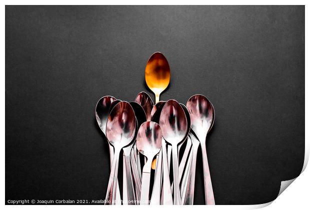 A luxury golden spoon stands out from the rest of the simpler an Print by Joaquin Corbalan