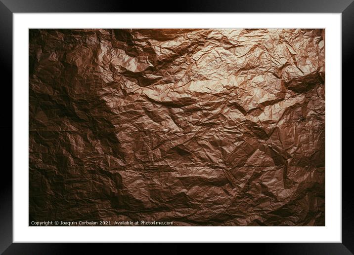 Crumpled and expanded paper with natural texture of reddish tone Framed Mounted Print by Joaquin Corbalan