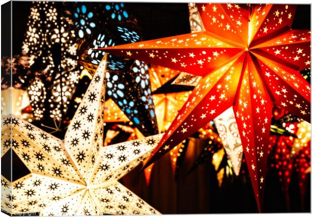 Colourful Illuminated Christmas Star Decorations Canvas Print by Peter Greenway