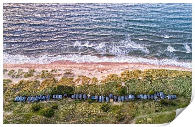 Beach huts nestled in the dunes - Brancaster beach Print by Gary Pearson