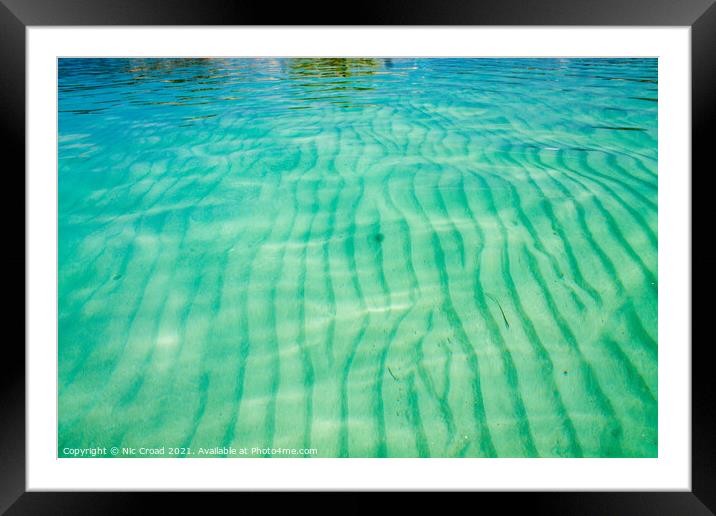 Sand ripple patters in a clear sea Framed Mounted Print by Nic Croad