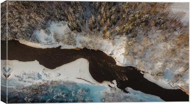 Aerial shot winter of forest river surrounded by greens and trees	 Canvas Print by Emils Vanags