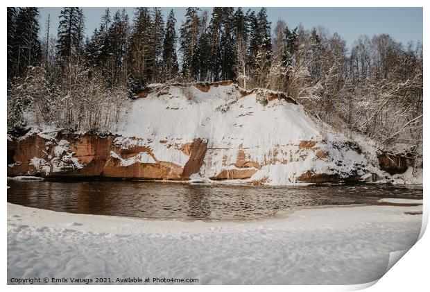rock cliff and cave by the river Gauja in the Gauja National Park in Latvia in winter with beautiful sun through the forest Print by Emils Vanags