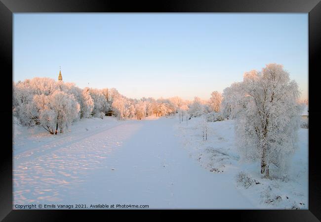 fields and forests, and a frozen river covered with snow by winter frost. empty countryside	 Framed Print by Emils Vanags