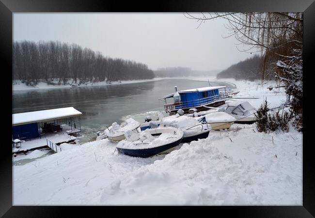 Boats under the snow on the river Borcea  Framed Print by liviu iordache