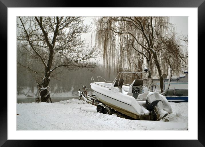 A boat covered in snow  Framed Mounted Print by liviu iordache