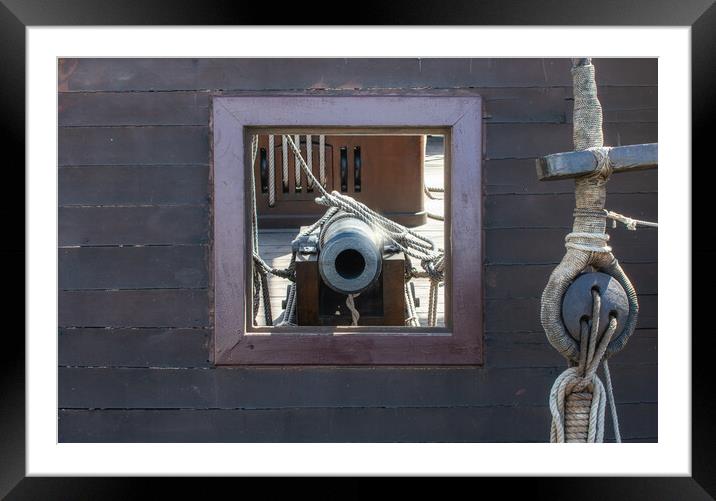 frontal view of cannon in its porthole Spanish galleon Framed Mounted Print by David Galindo