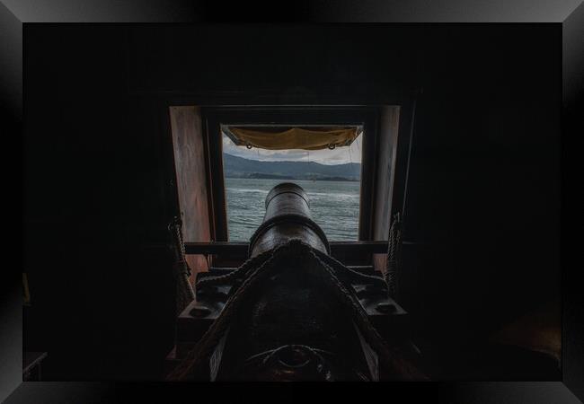 cannon inside a Spanish galleon aiming at enemies Framed Print by David Galindo