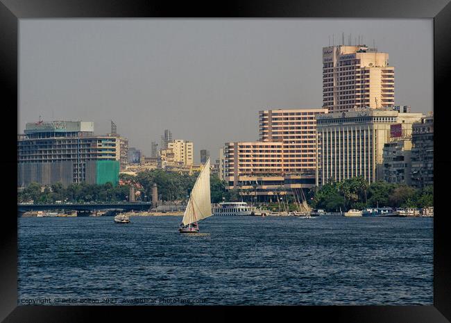 Arab Dhow sailing vessel on the River Nile, Cairo, Egypt. Framed Print by Peter Bolton