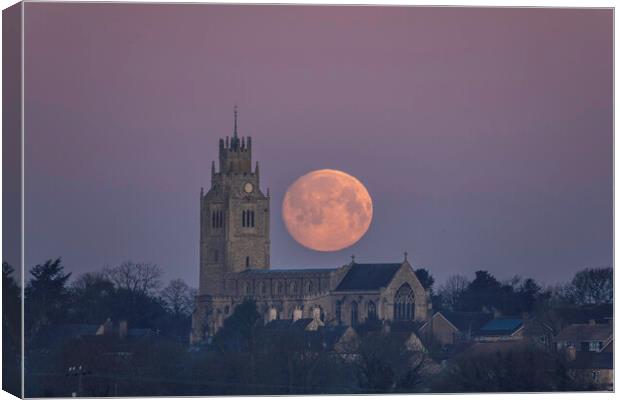 Snow Moon (or Hunger Moon) setting behind St Andrew's Church, Su Canvas Print by Andrew Sharpe