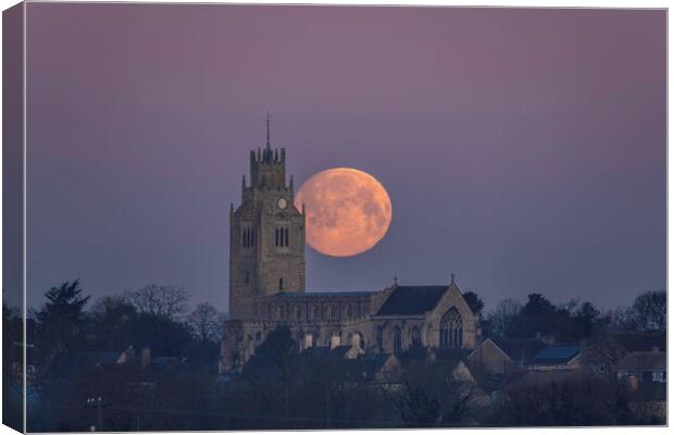 Snow Moon (or Hunger Moon) setting behind St Andre Canvas Print by Andrew Sharpe