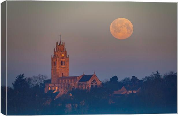 Snow Moon (or Hunger Moon) setting behind St Andrew's Church, Su Canvas Print by Andrew Sharpe