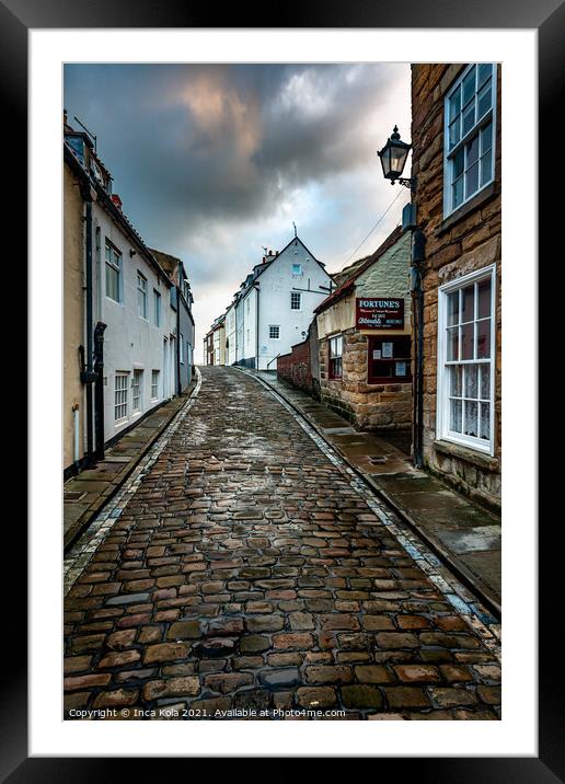 Whitby's Cobbled Streets and Fortune's Kipper House Framed Mounted Print by Inca Kala