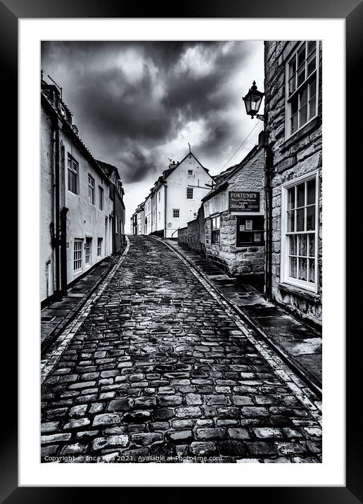 Whitby's Cobbled Streets and Fortune's Kipper House Framed Mounted Print by Inca Kala