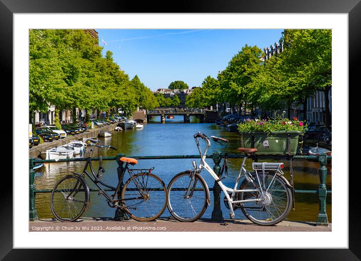 Bikes on the bridge that crosses the canal in Amsterdam, Netherlands Framed Mounted Print by Chun Ju Wu