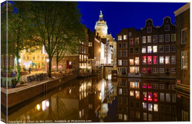 Night view of buildings and boats along the canal in Amsterdam, Netherlands Canvas Print by Chun Ju Wu