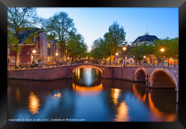 Reflection of bridge along the canal at night in Amsterdam, Netherlands Framed Print by Chun Ju Wu