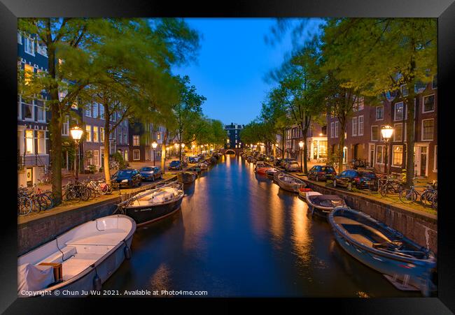 Night view of buildings and boats along the canal in Amsterdam, Netherlands Framed Print by Chun Ju Wu