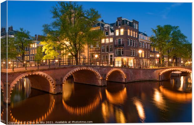 Reflection of bridge along the canal at night in Amsterdam, Netherlands Canvas Print by Chun Ju Wu
