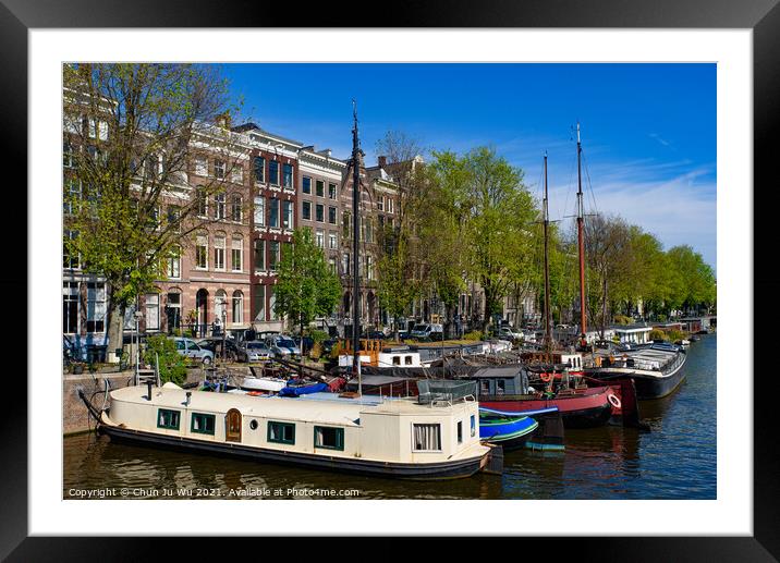 Buildings and boats along the canal in Amsterdam, Netherlands Framed Mounted Print by Chun Ju Wu