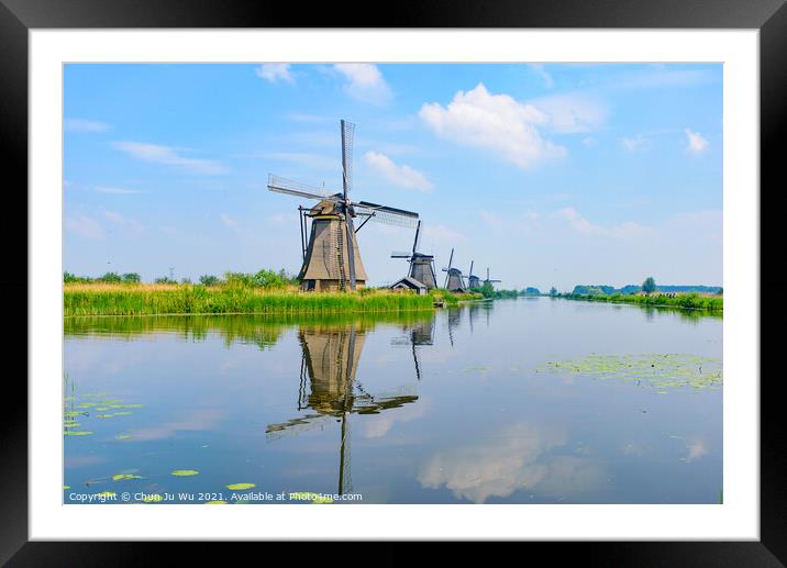 The windmills and the reflection on water in Kinderdijk, a UNESCO World Heritage site in Rotterdam, Netherlands Framed Mounted Print by Chun Ju Wu