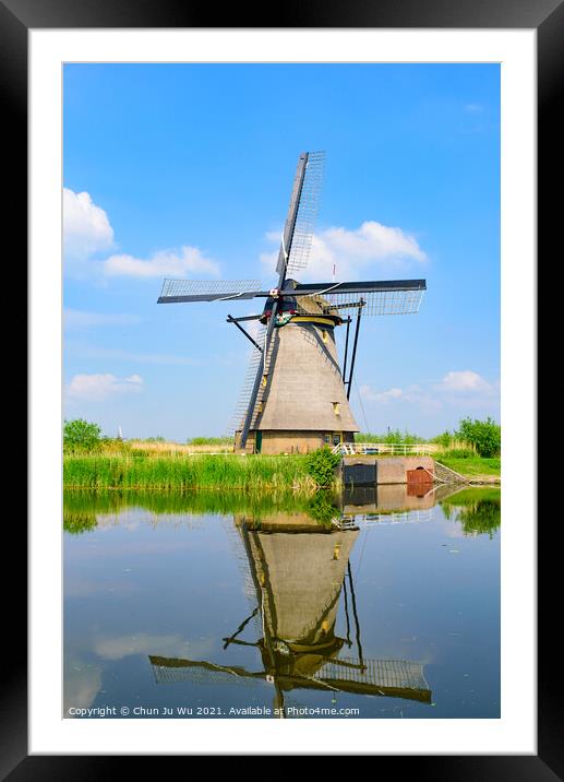 The windmills and the reflection on water in Kinderdijk, a UNESCO World Heritage site in Rotterdam, Netherlands Framed Mounted Print by Chun Ju Wu