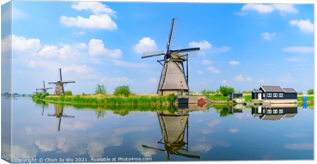 Panorama of the windmills and the reflection on water in Kinderdijk, a UNESCO World Heritage site in Rotterdam, Netherlands Canvas Print by Chun Ju Wu
