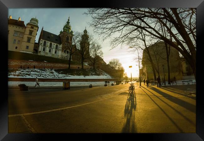 Krakow, Poland - Road to the main entrance to royal Wawel Castle in Cracow and bicycle parked against sunset Framed Print by Arpan Bhatia