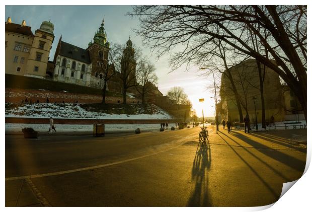 Krakow, Poland - Road to the main entrance to royal Wawel Castle in Cracow and bicycle parked against sunset Print by Arpan Bhatia