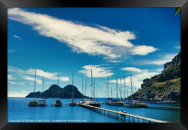 Bay with boats on a jetty Framed Print by Travel and Pixels 