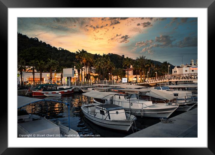 Fishing and sailing boats in the marina at sunset Framed Mounted Print by Stuart Chard