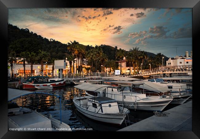 Fishing and sailing boats in the marina at sunset Framed Print by Stuart Chard